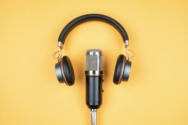Image of podcast microphone and headphones.