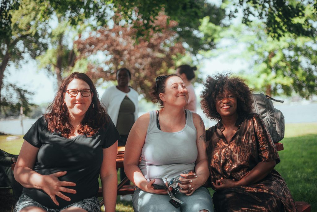 Female presenting people in a park