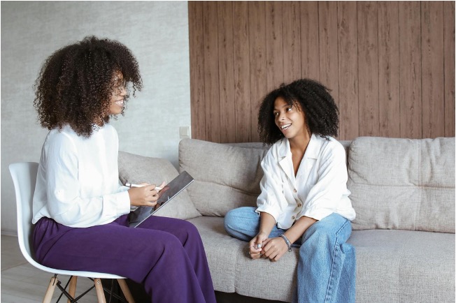 Two Black women talking