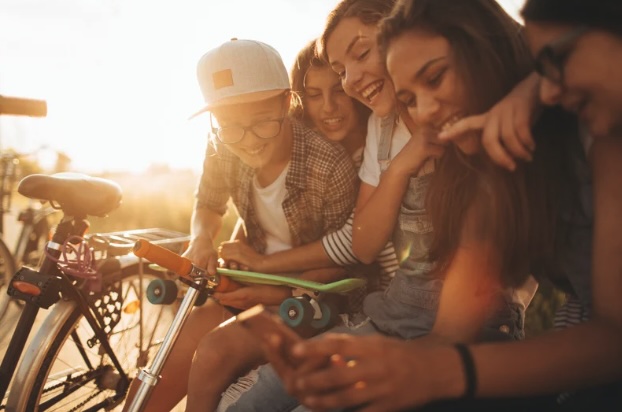 Young people looking at a phone